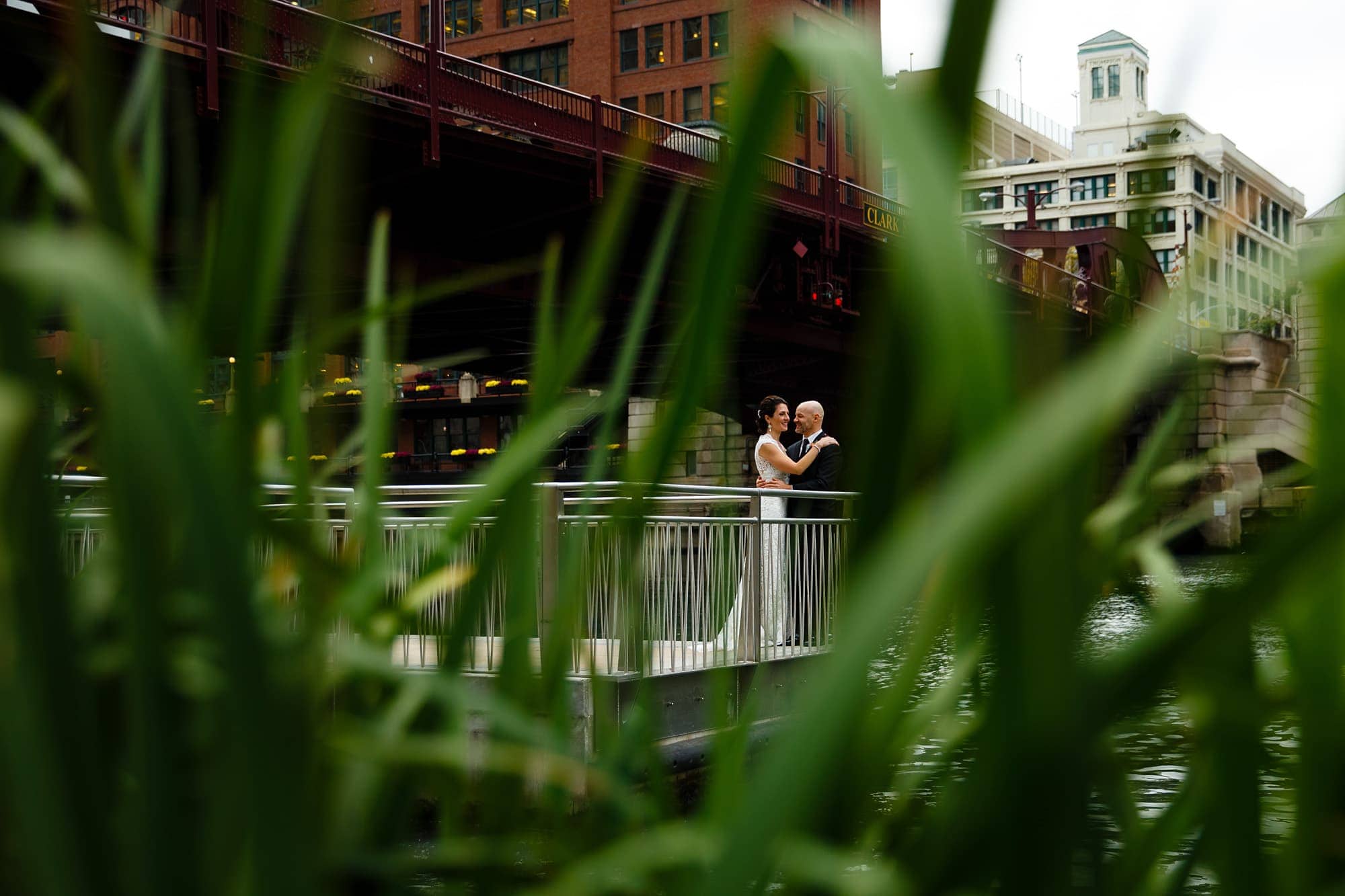 Christina and Brad share a moment together on their wedding day on the river walk under the Clark Street bridge
