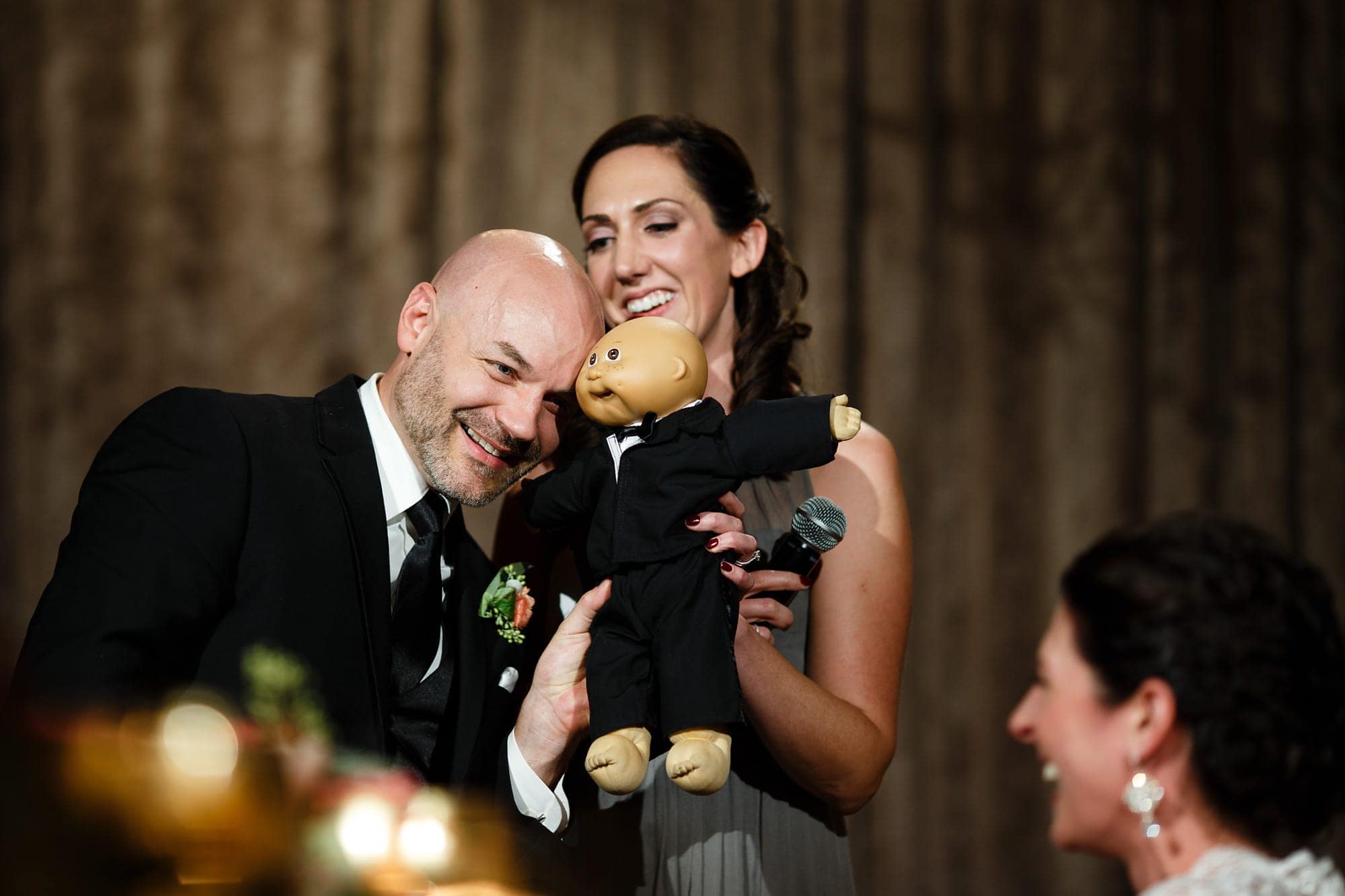 Brad aknowledges his resembelance to a cabbage patch doll as Christina's sister gives a speech during their Bridgeport Art Center wedding