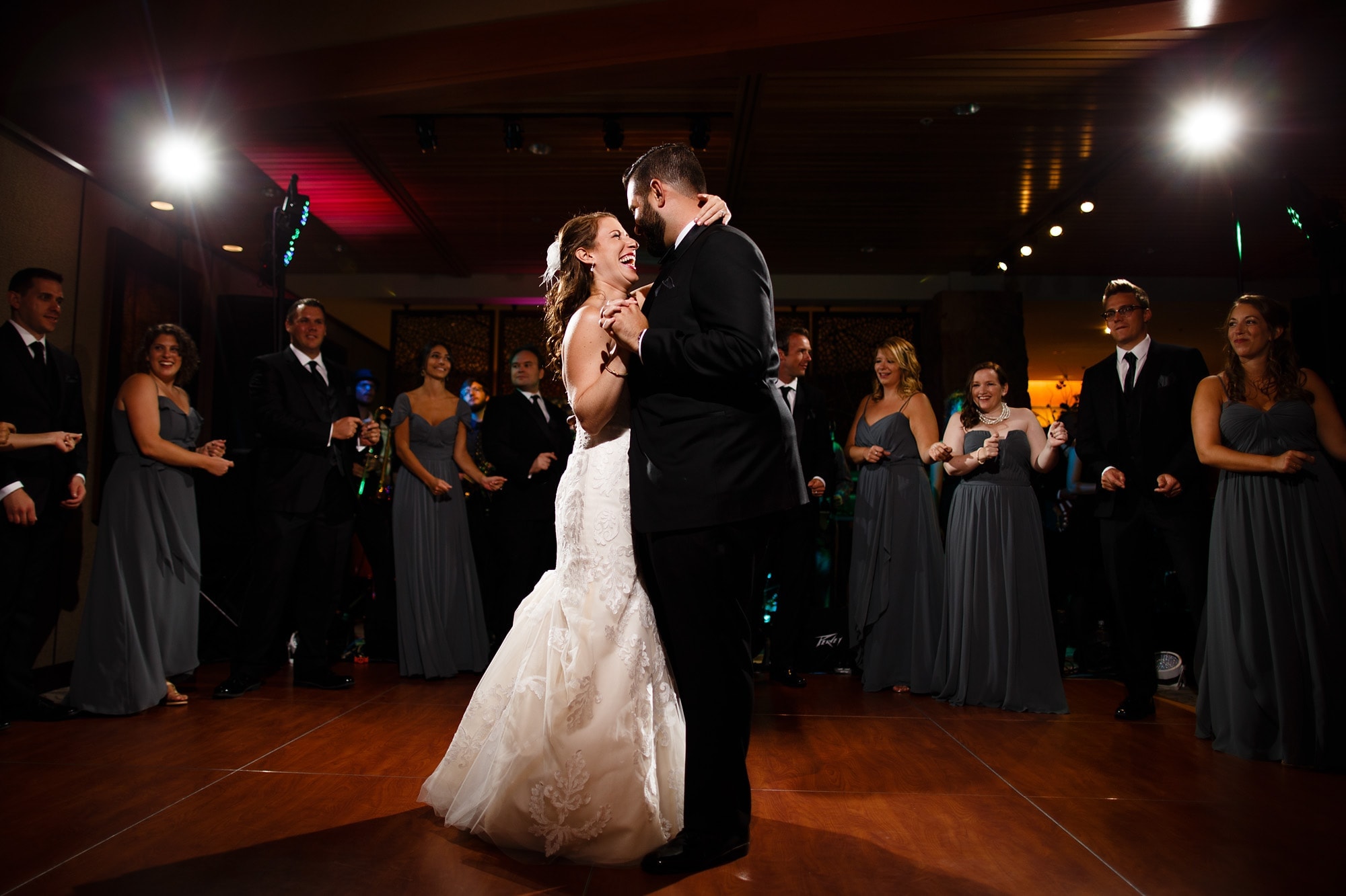Devan and Joshua laugh during their first dance at Garden of the Gods Club