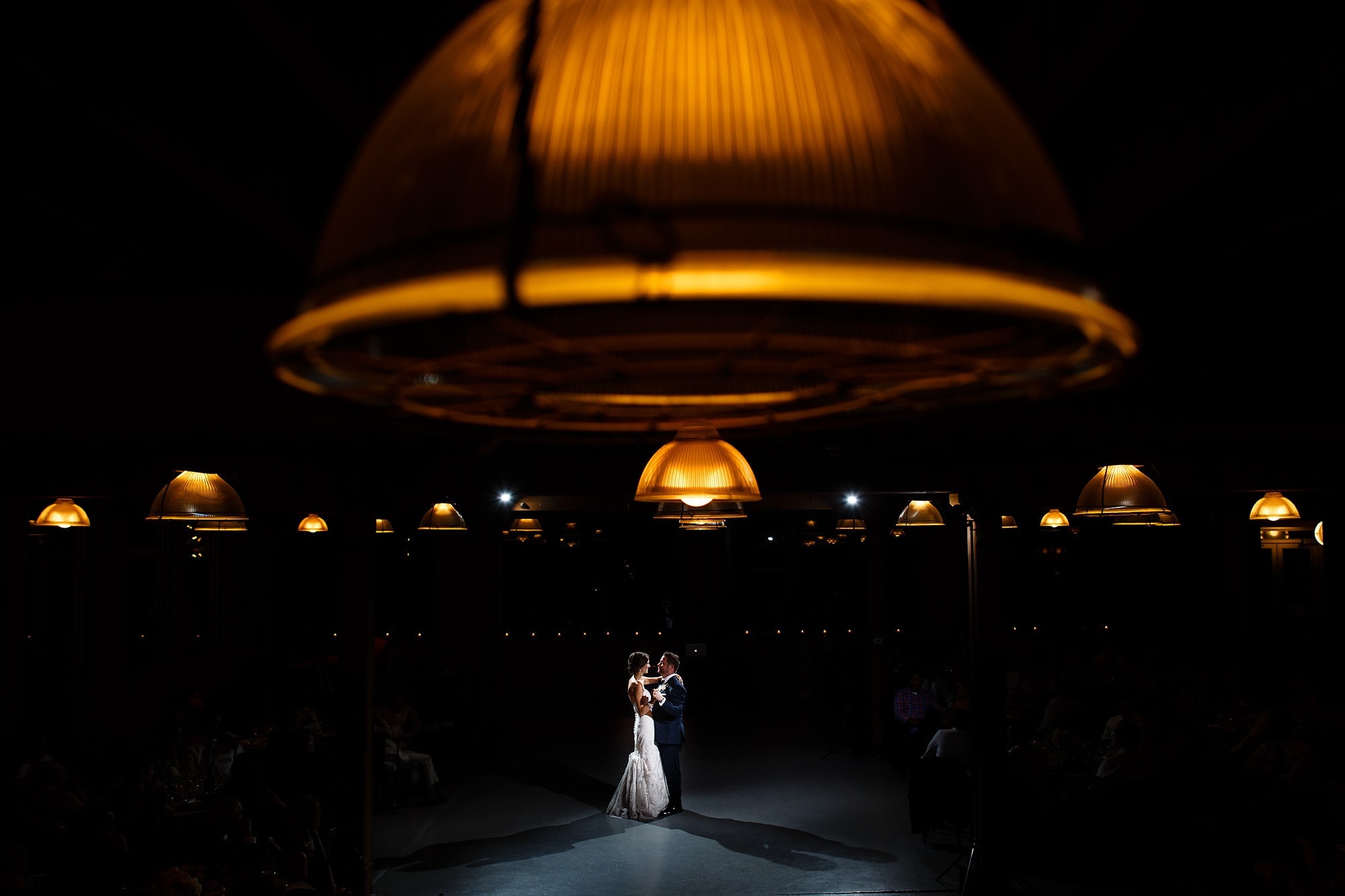 A couple share their first dance at Architectural Artifacts in the Ravenswood neighborhood of Chicago, Illinois.