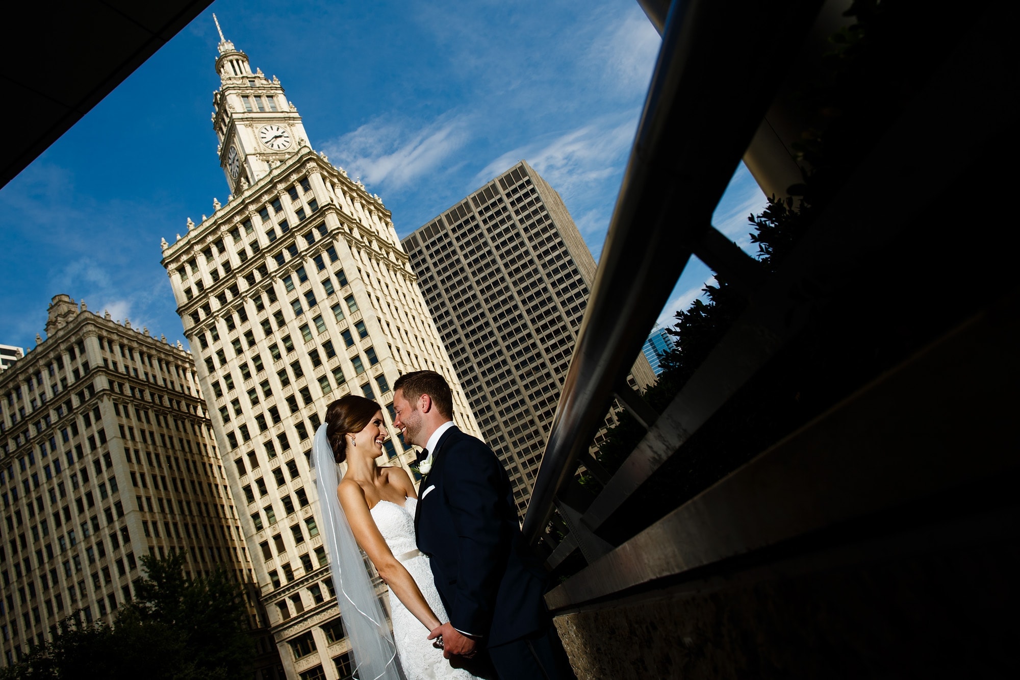 Matt and Kara share a smile together during a portrait session under Trump Tower and near the Wrigley Building in Chicago in August.