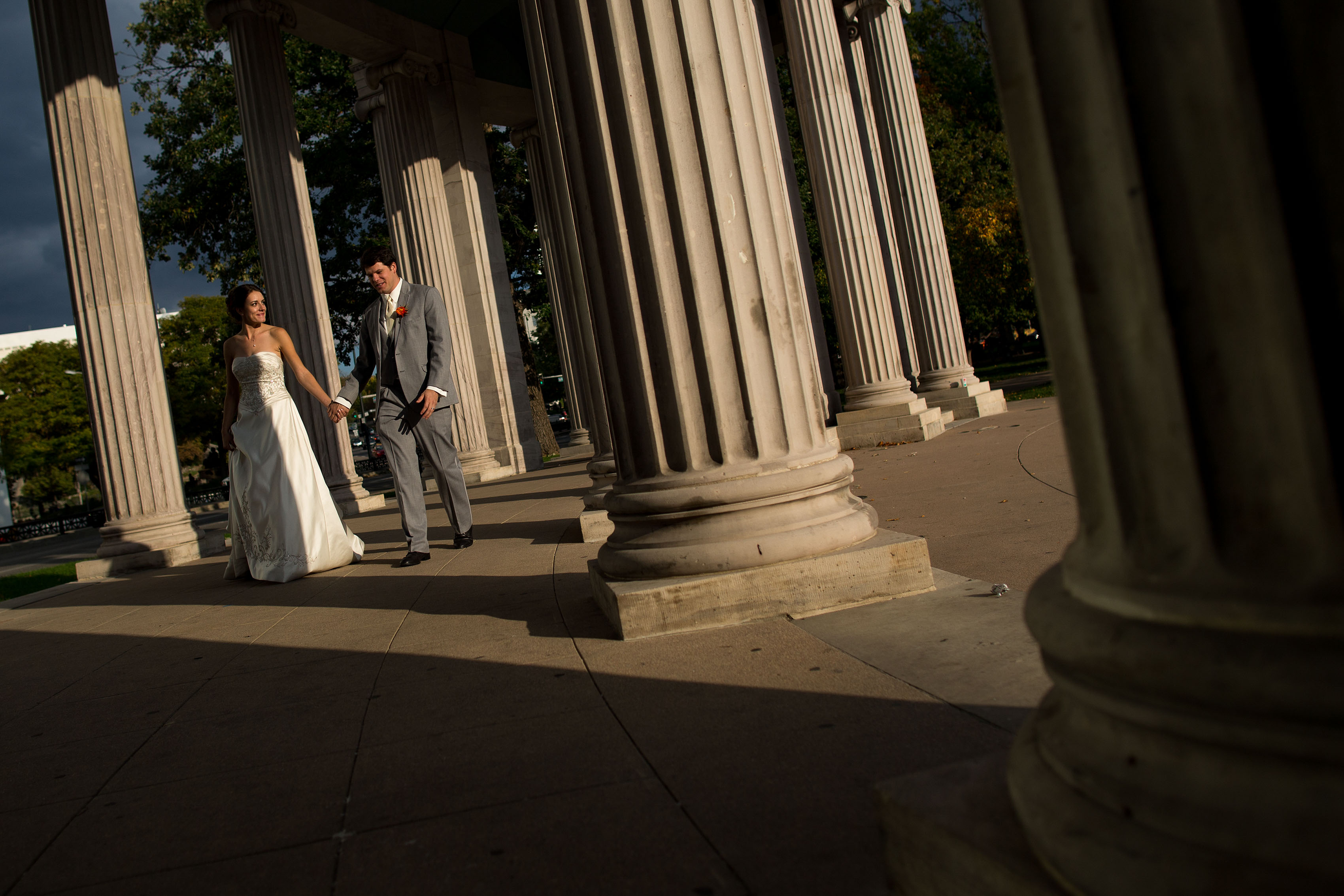 Couple walks in Civic Center park on their wedding day