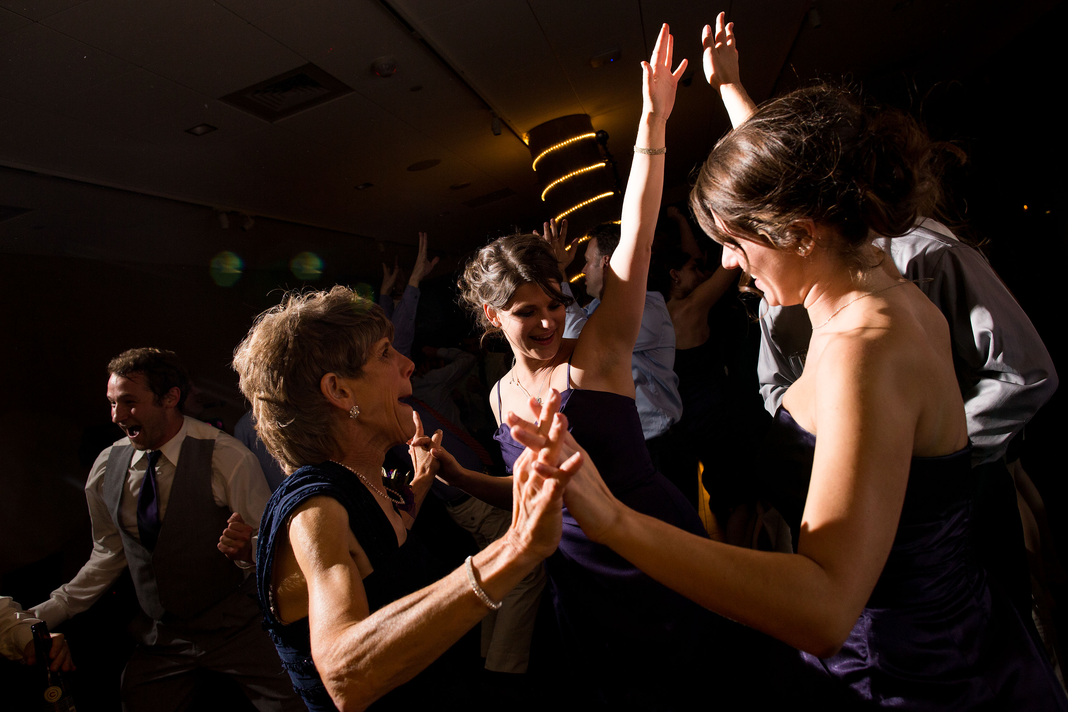 Guests dance together at the History Colorado Center during a wedding
