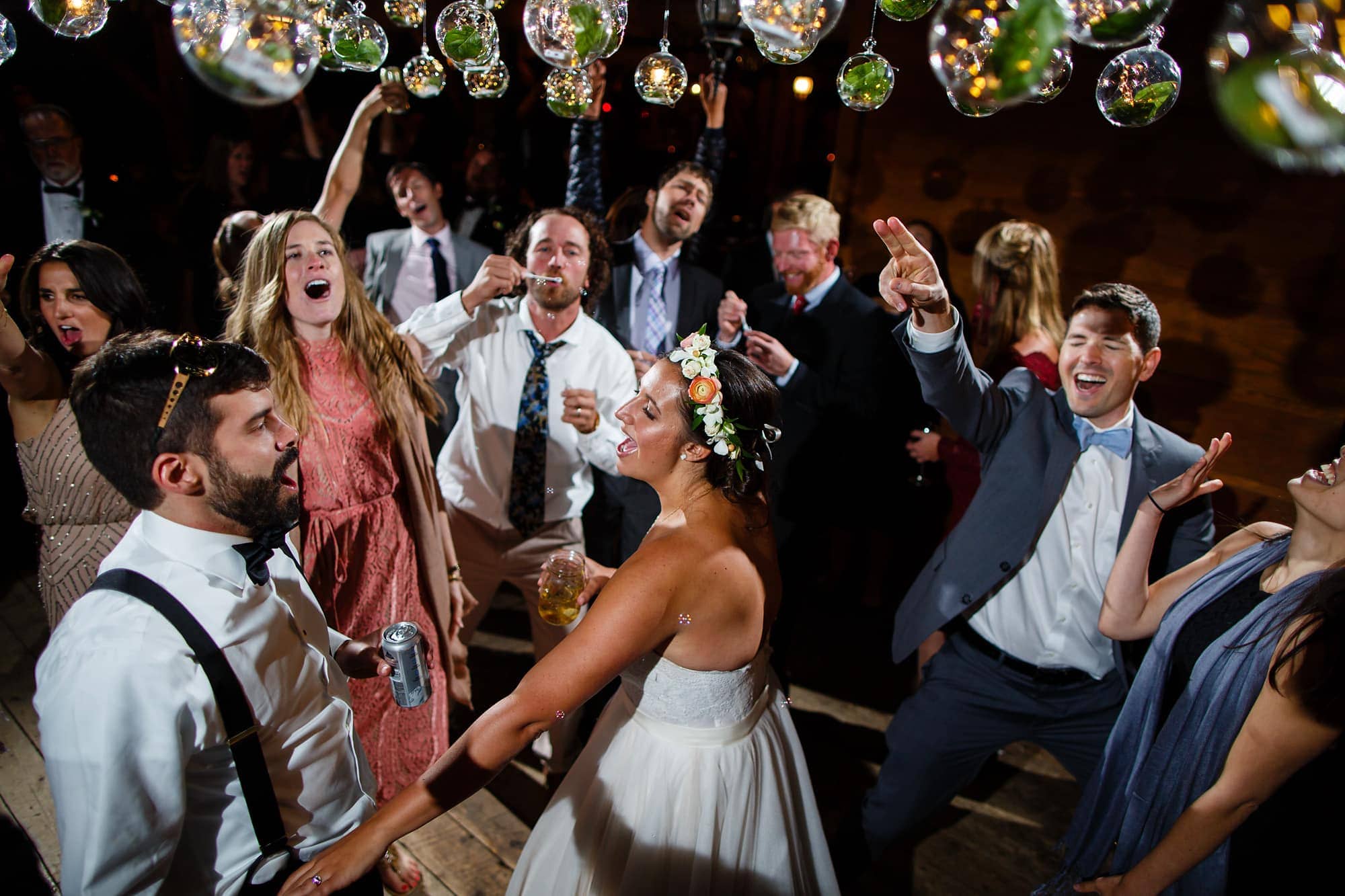 Guests dance during the reception at Piney River Ranch near Vail, Colorado.