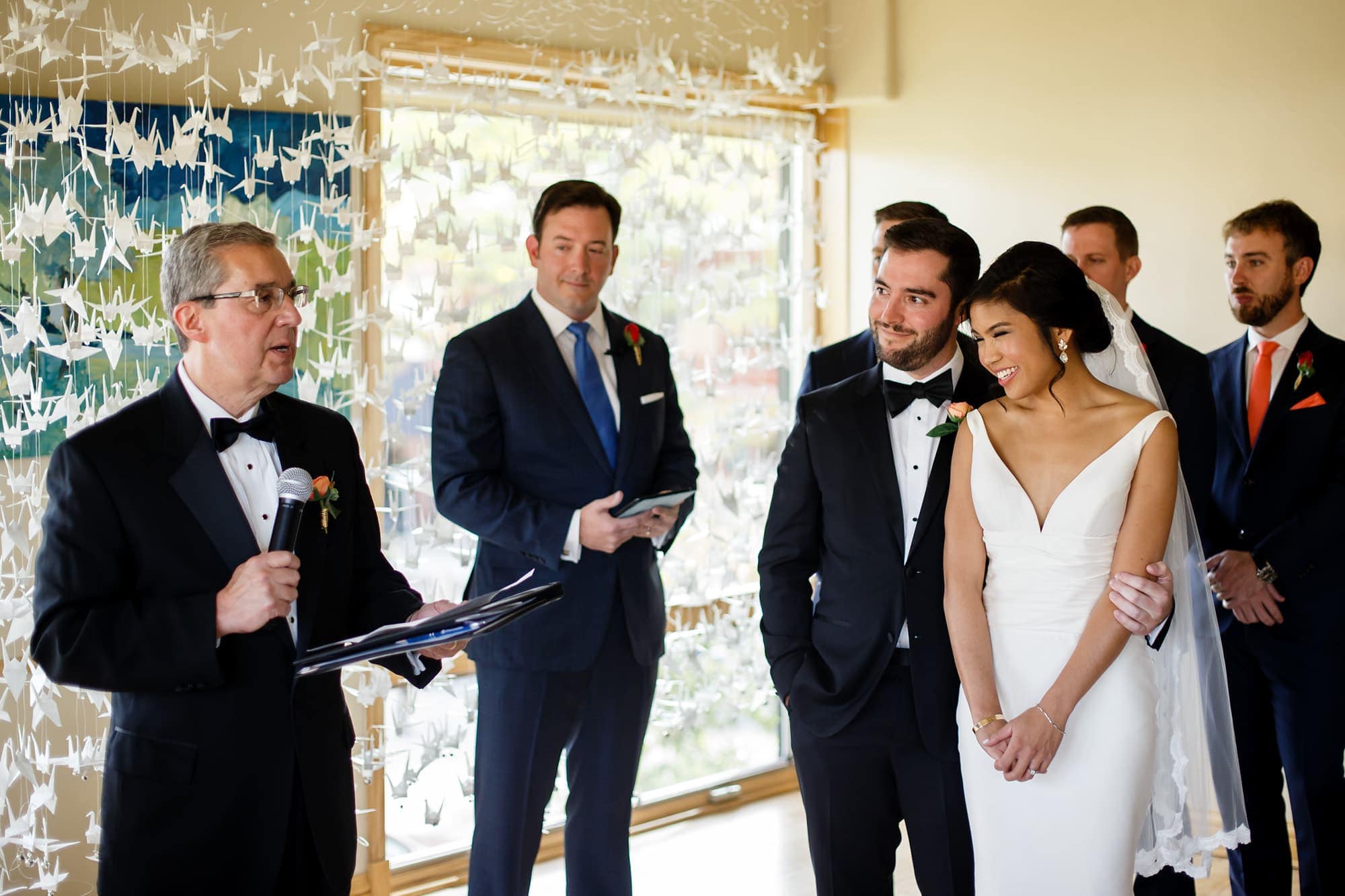The father of the groom reads a passage during Megan and Bryan's wedding at Rembrandt Yard