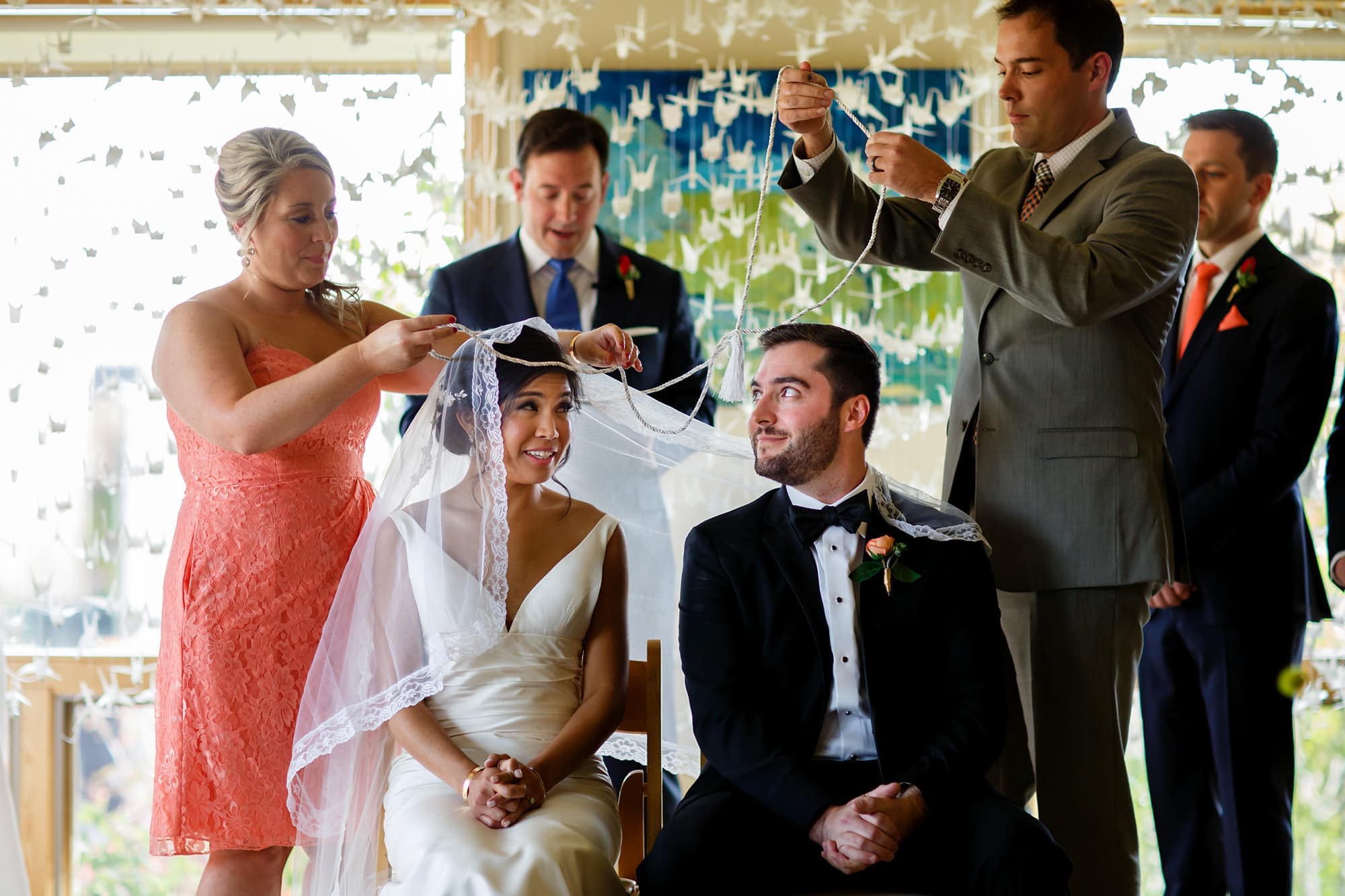 Bryan and Megan participate in the veil and cord ceremony during their Rembrandt Yard wedding