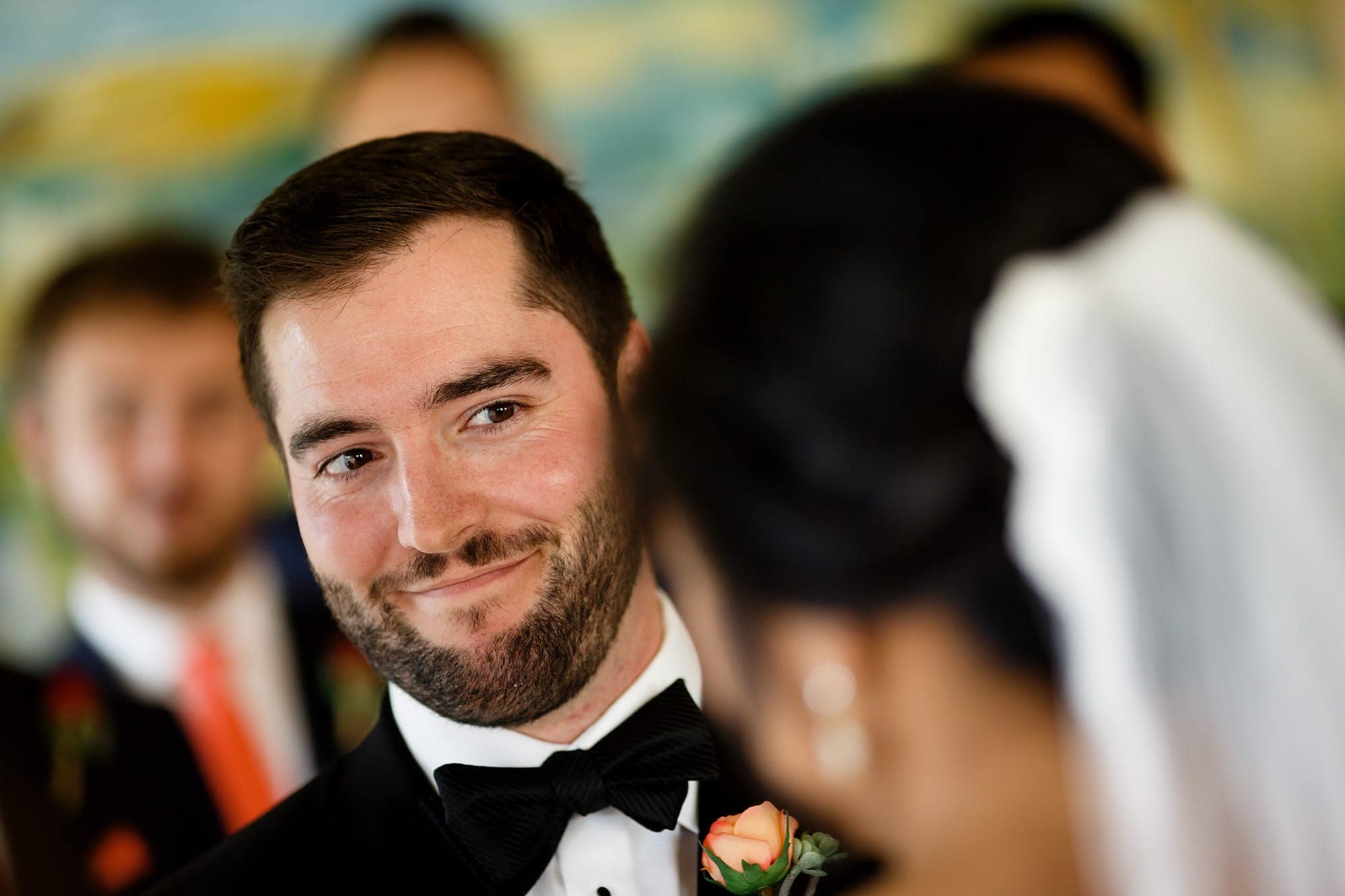 Bryan smiles at his bride during their wedding