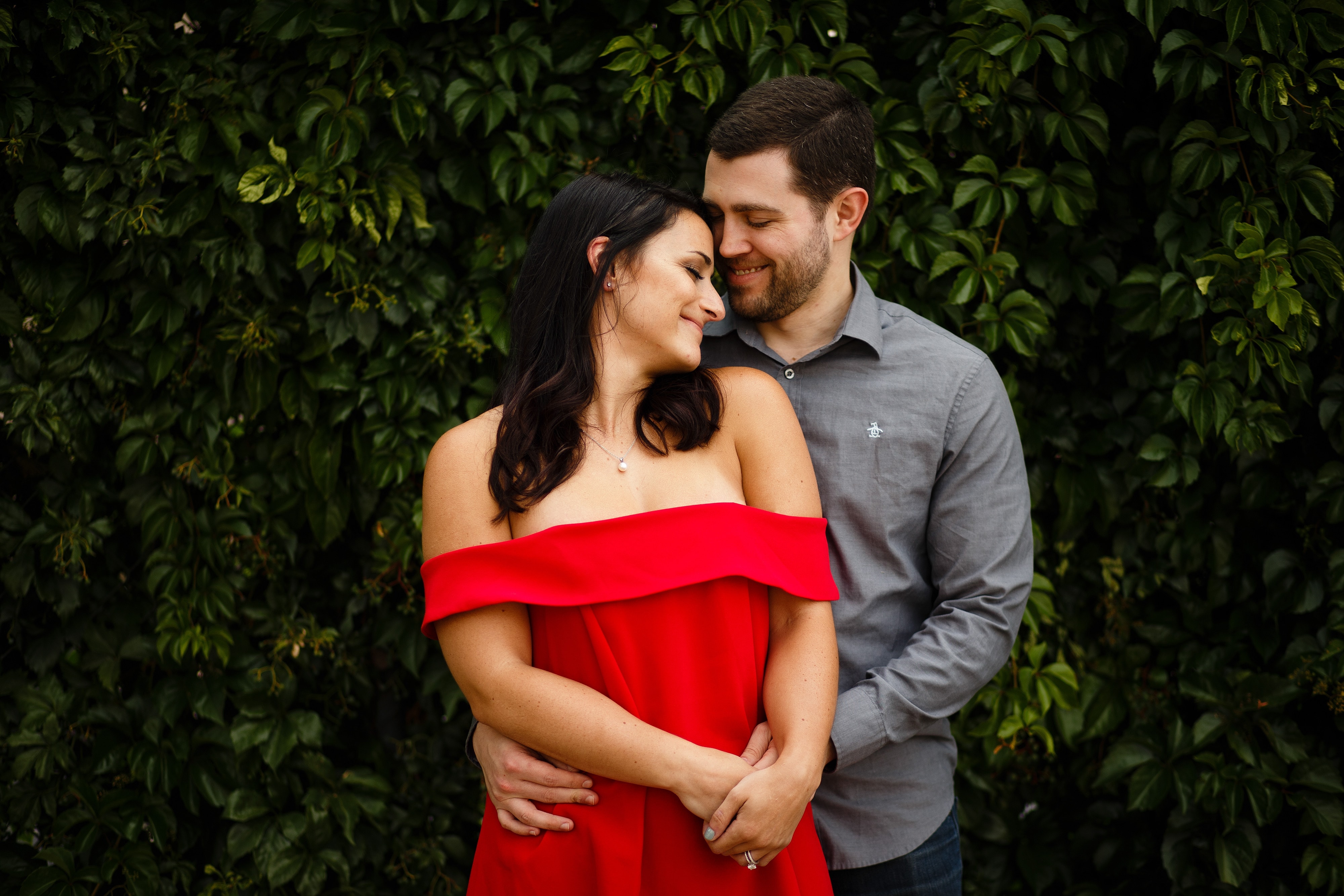 Danielle wears a red strapless blouse during her engagement session with Jordan in Denver