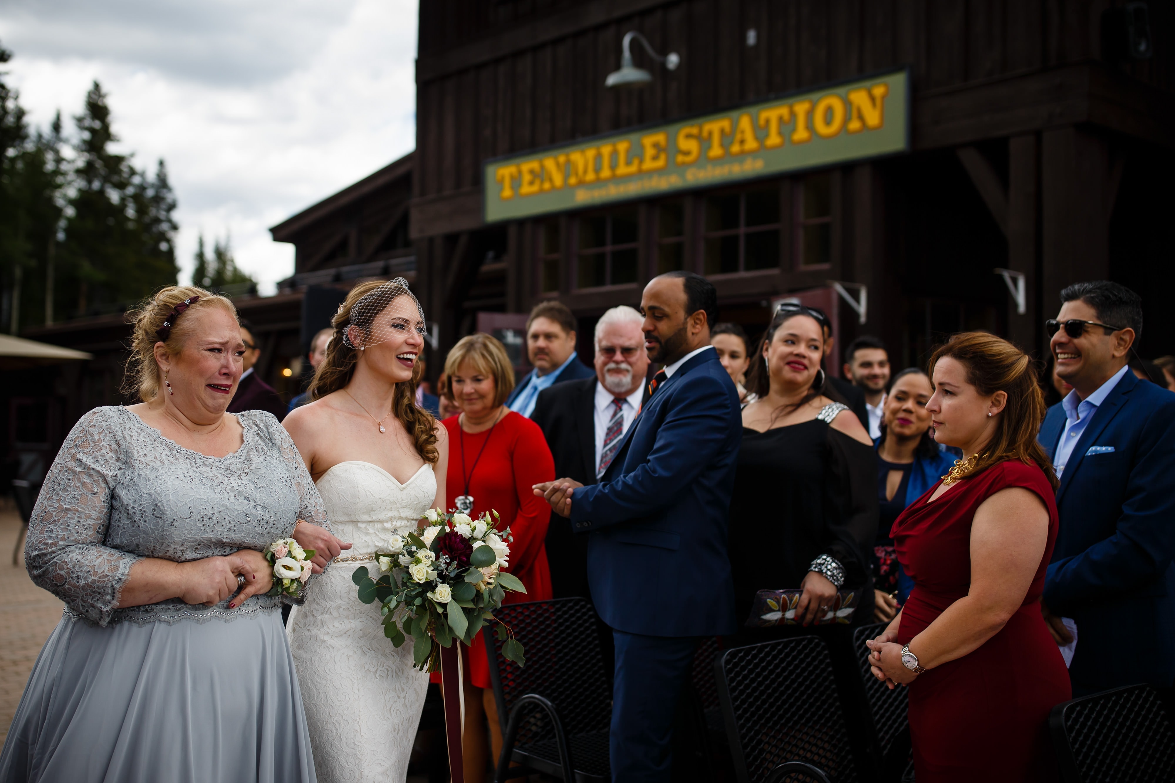 Sharon walks down the aisle with her mother during her TenMile Station wedding in Breckenridge on Peak 9
