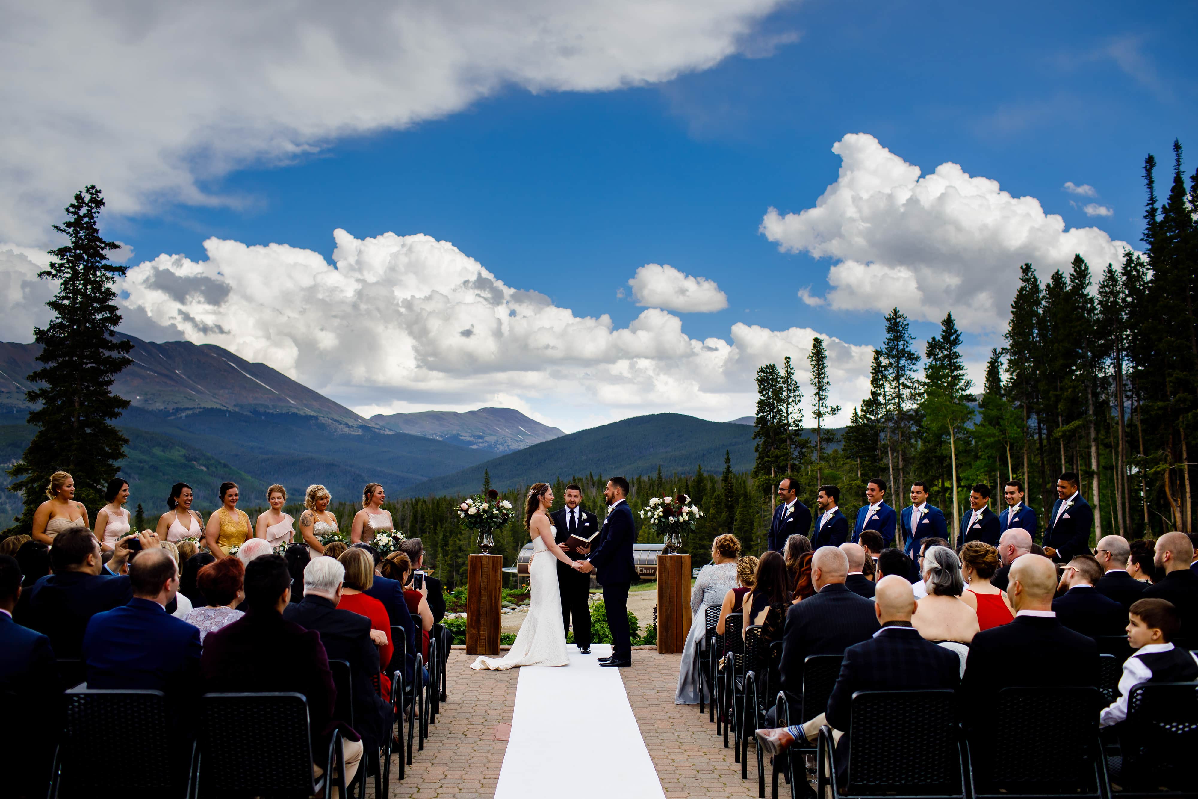 Nick and Sharon hold hands during their TenMile Station wedding ceremony in Breckenridge