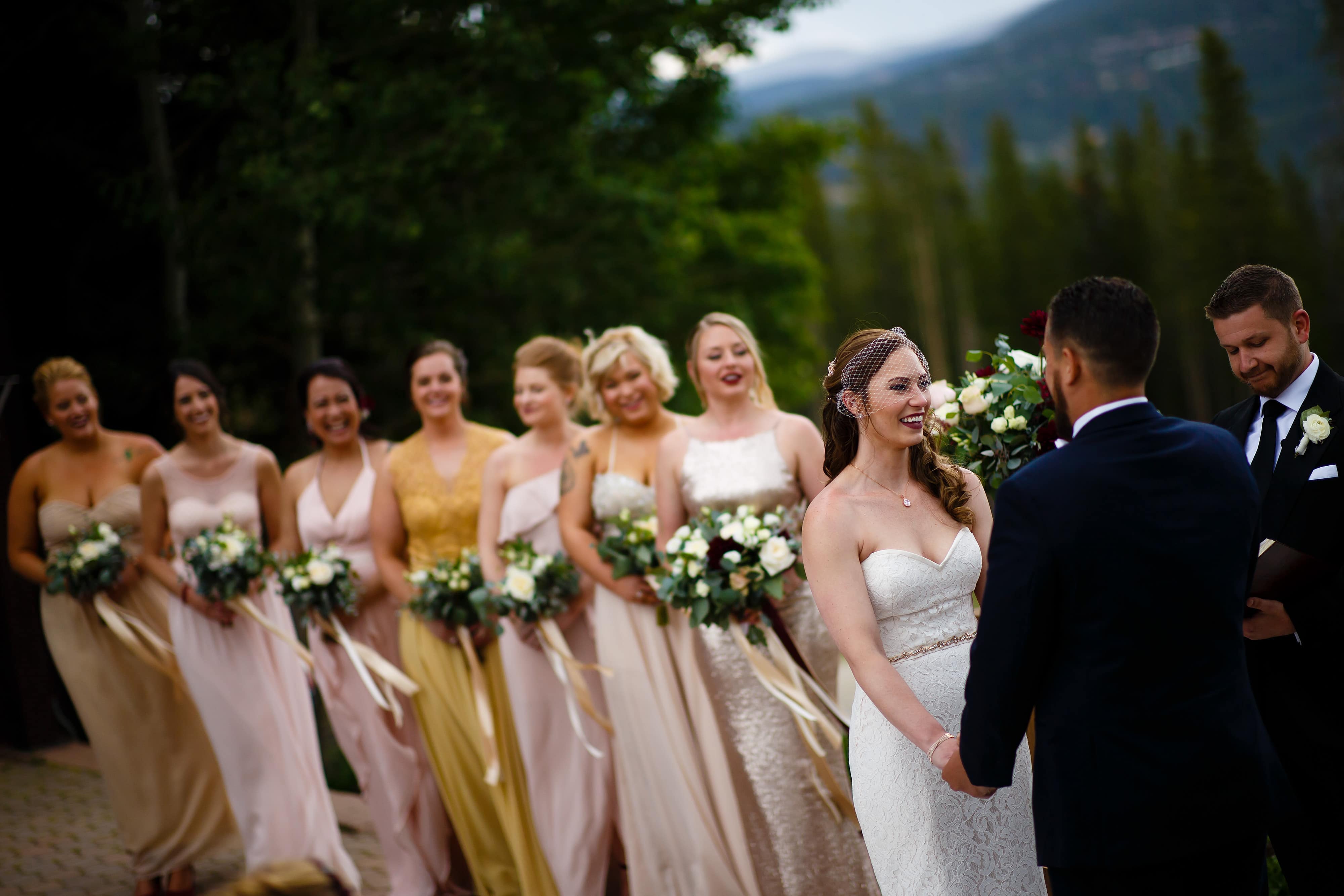 The bridesmaids look on during the ceremony