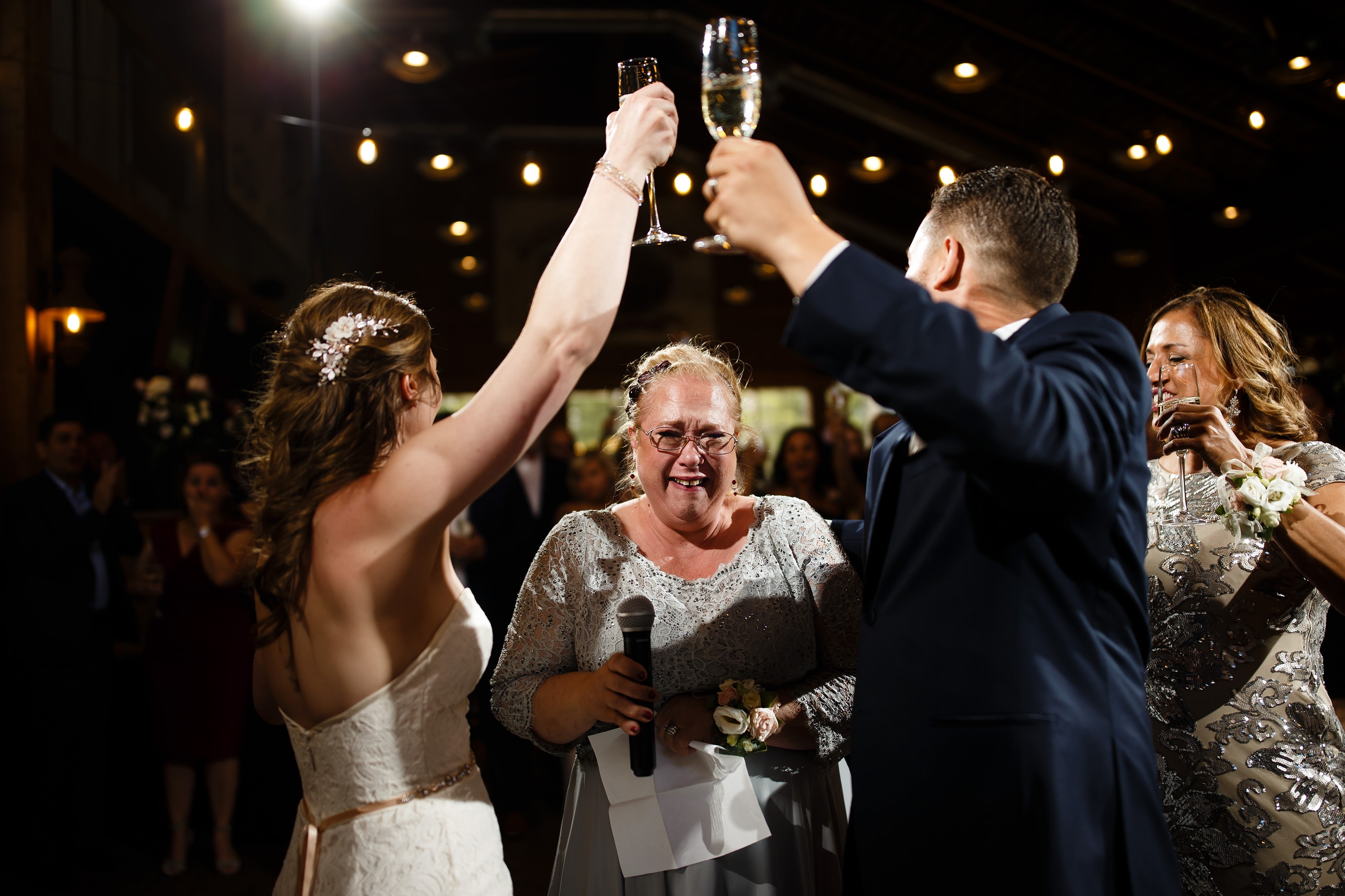 The couple toasts during their wedding
