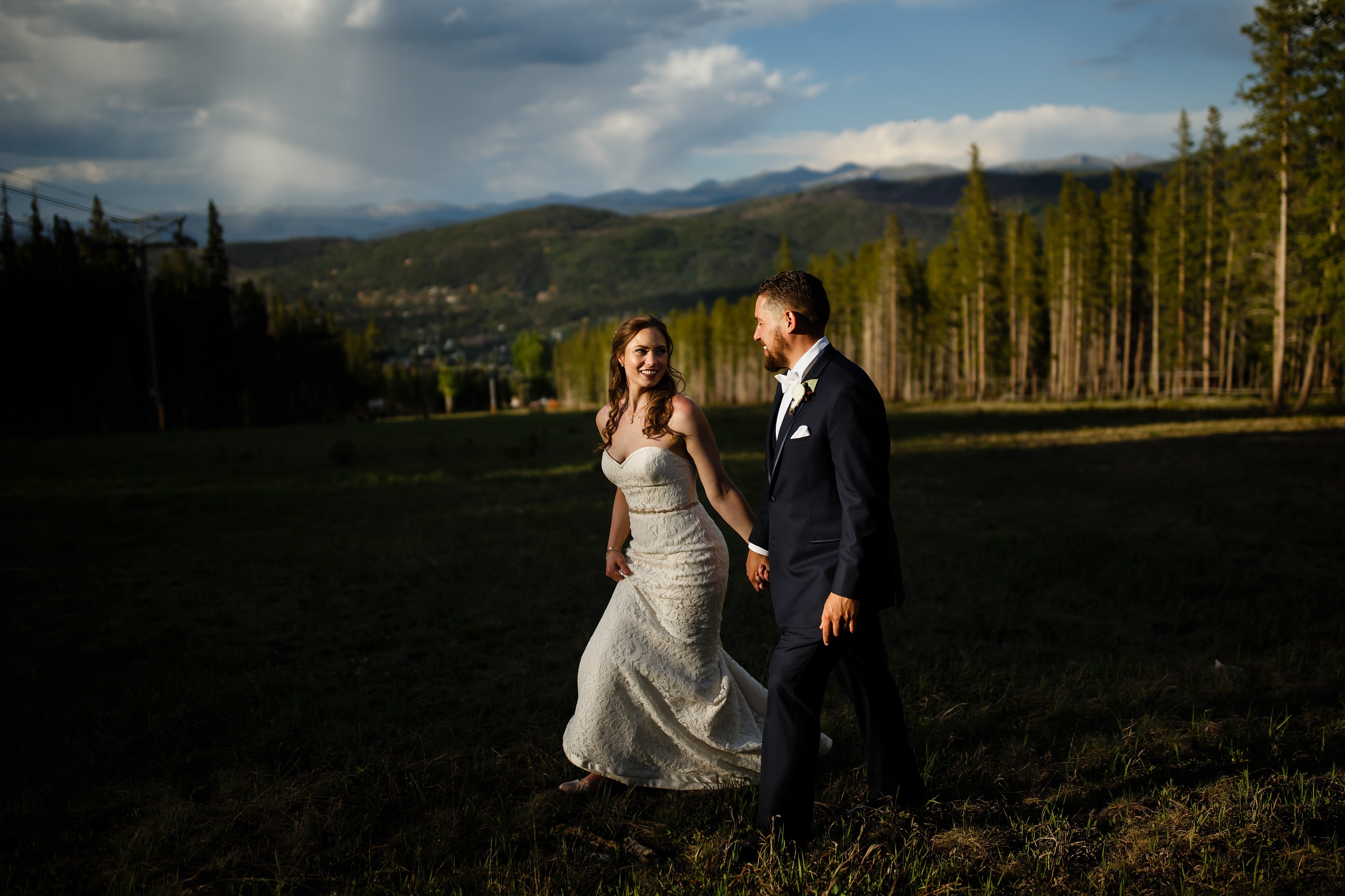Sharon and Nick walk together on Peak 9 during their wedding at TenMIle Station on Breckenridge mountain