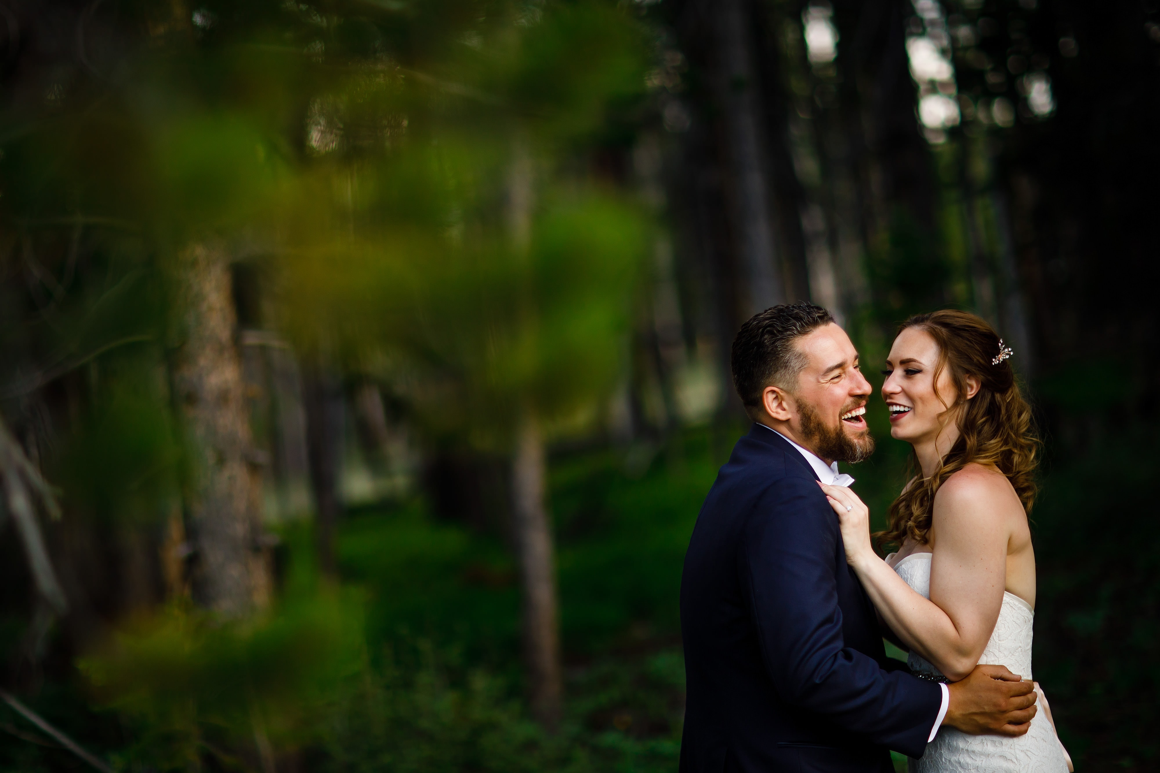 The couple share a laugh on Peak 9 during their wedding