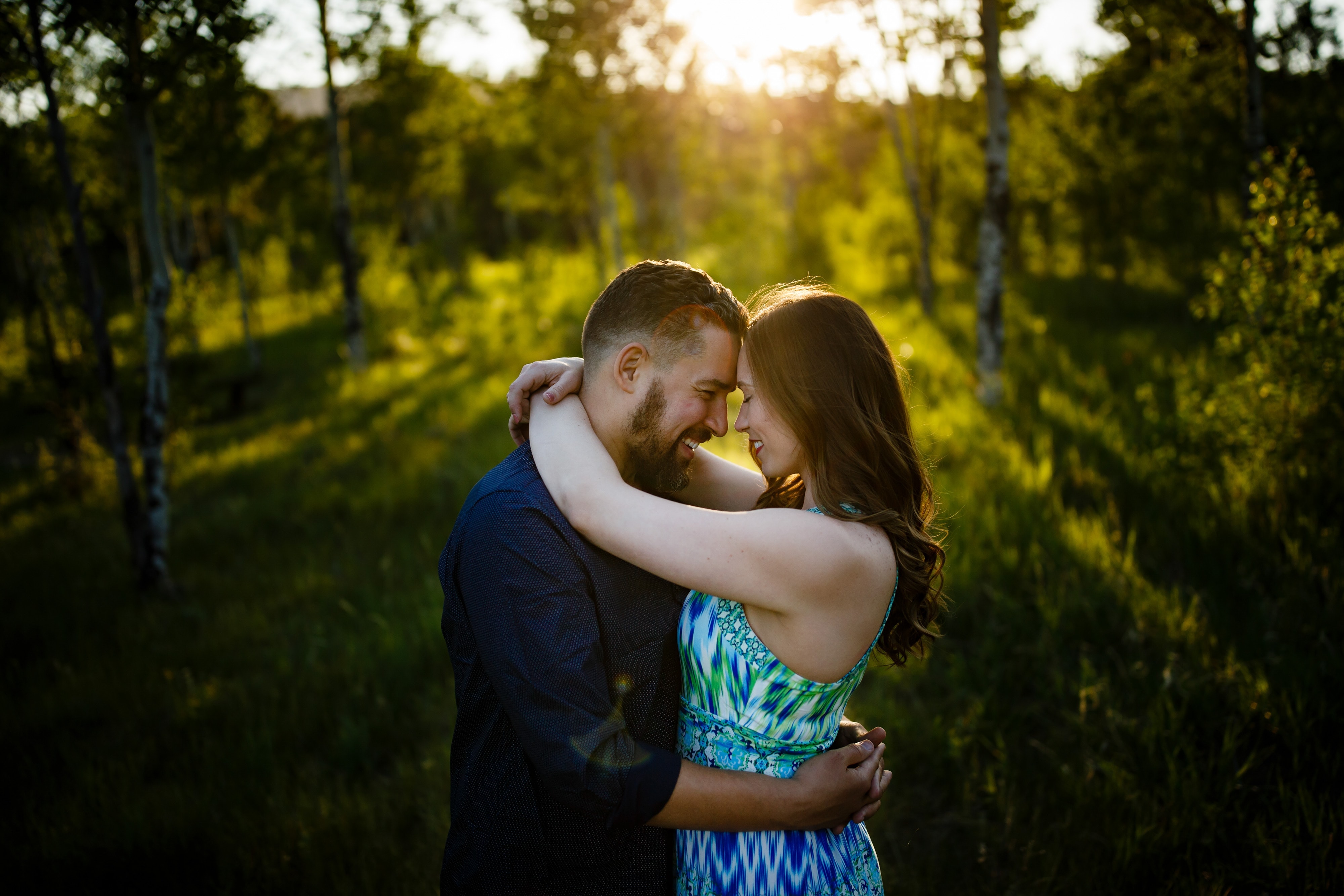 Nick embraces Sharon near the Mule Deer Trail during their colorful engagement in Golden Gate Canyon State Park