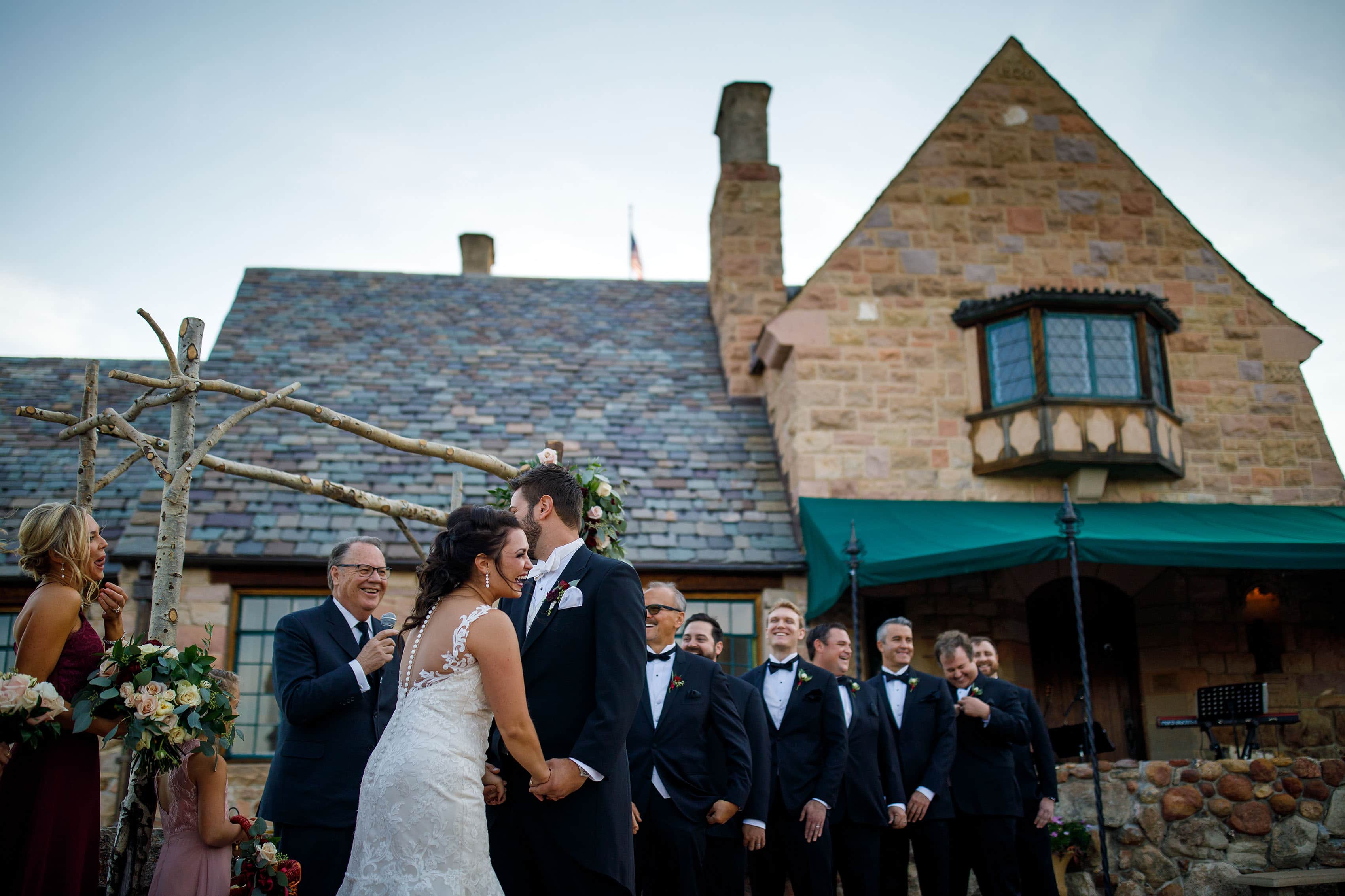 The bride laughs during her wedding ceremony at Cherokee Castle