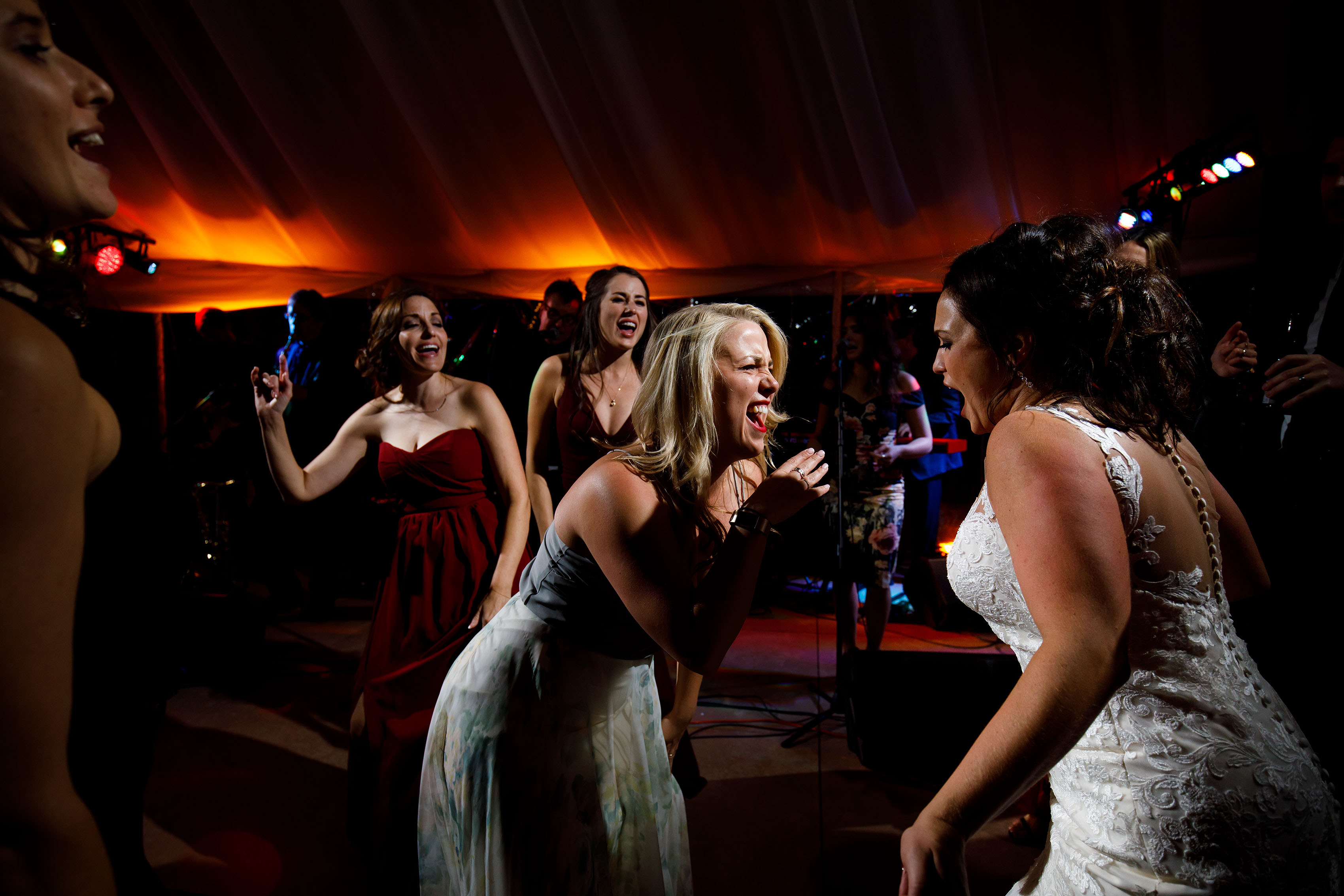 Guests dance together at Melissa and Jordan's wedding