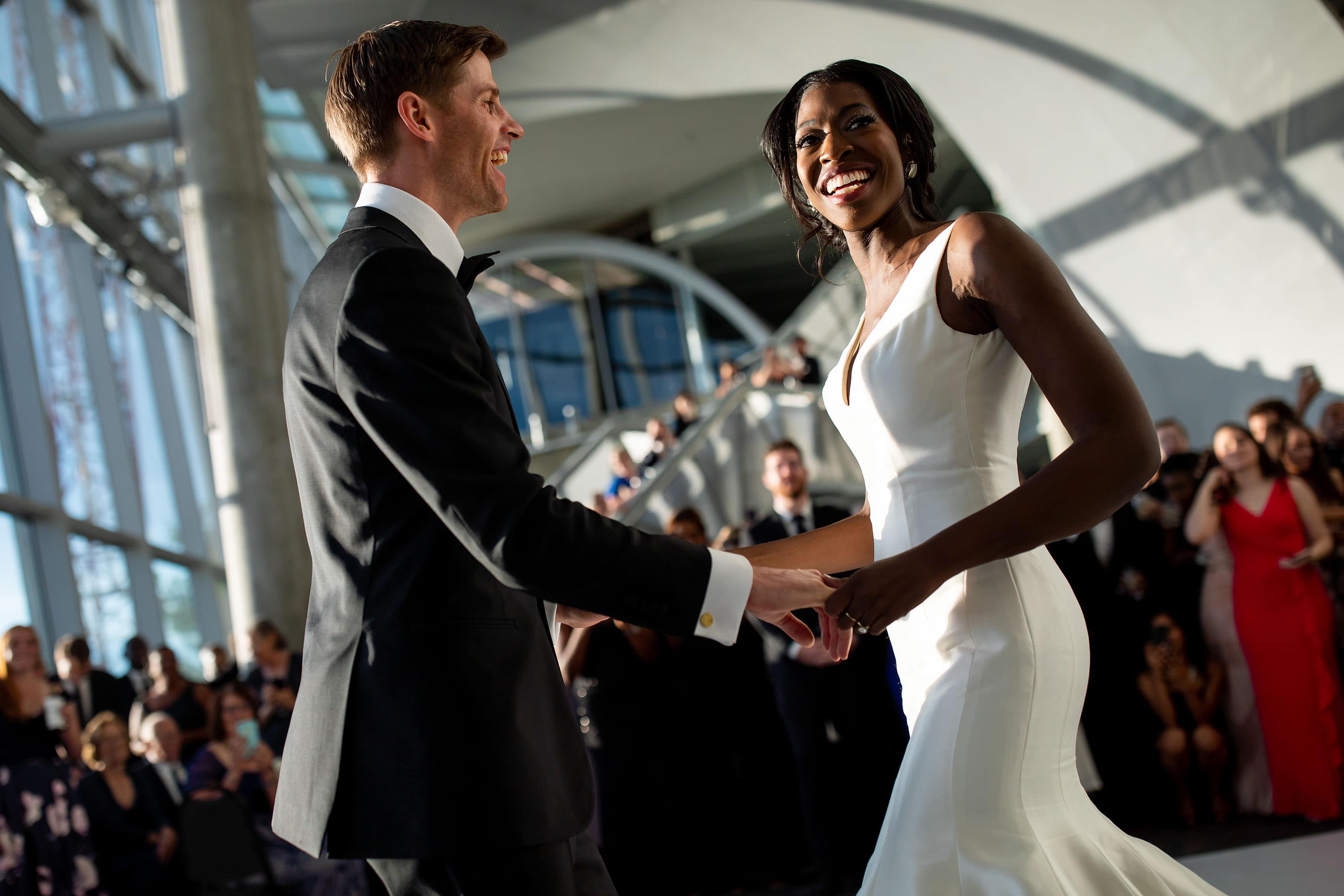 Newlyweds share their first dance in the Denver Museum of Nature and Science