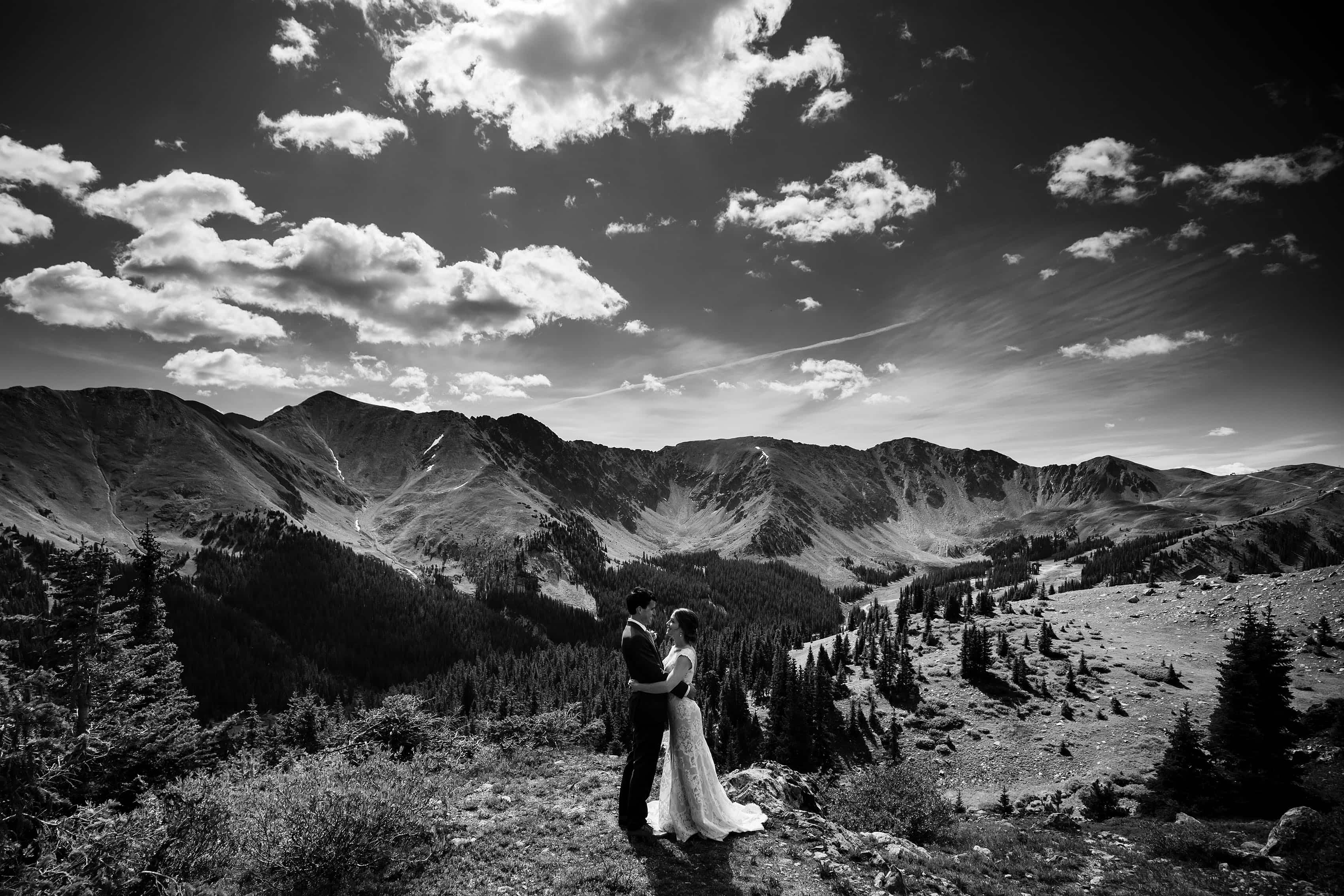 The bride and groom share a moment together atop Loveland Pass near Keystone, Colorado