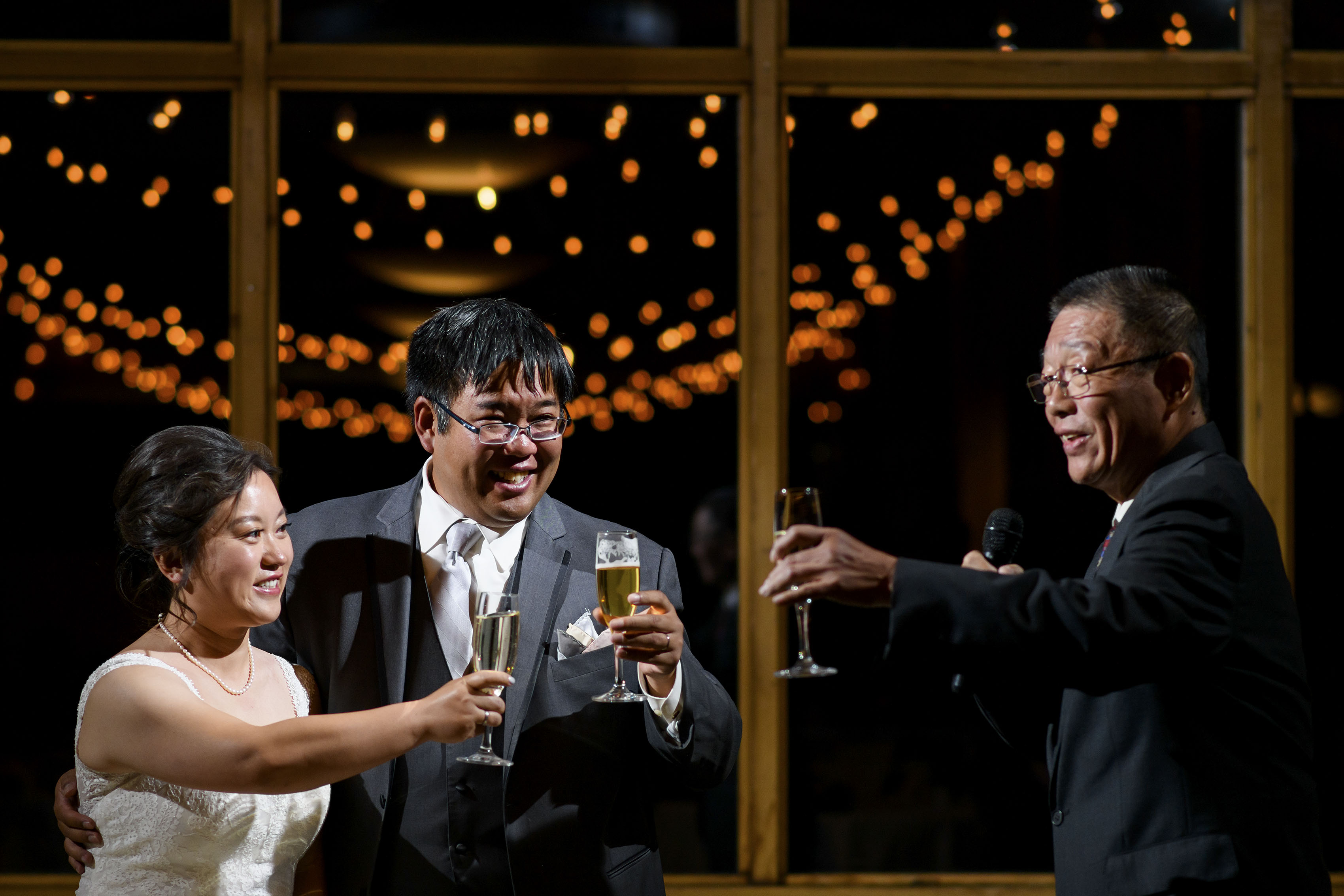 The bride and groom toast his father