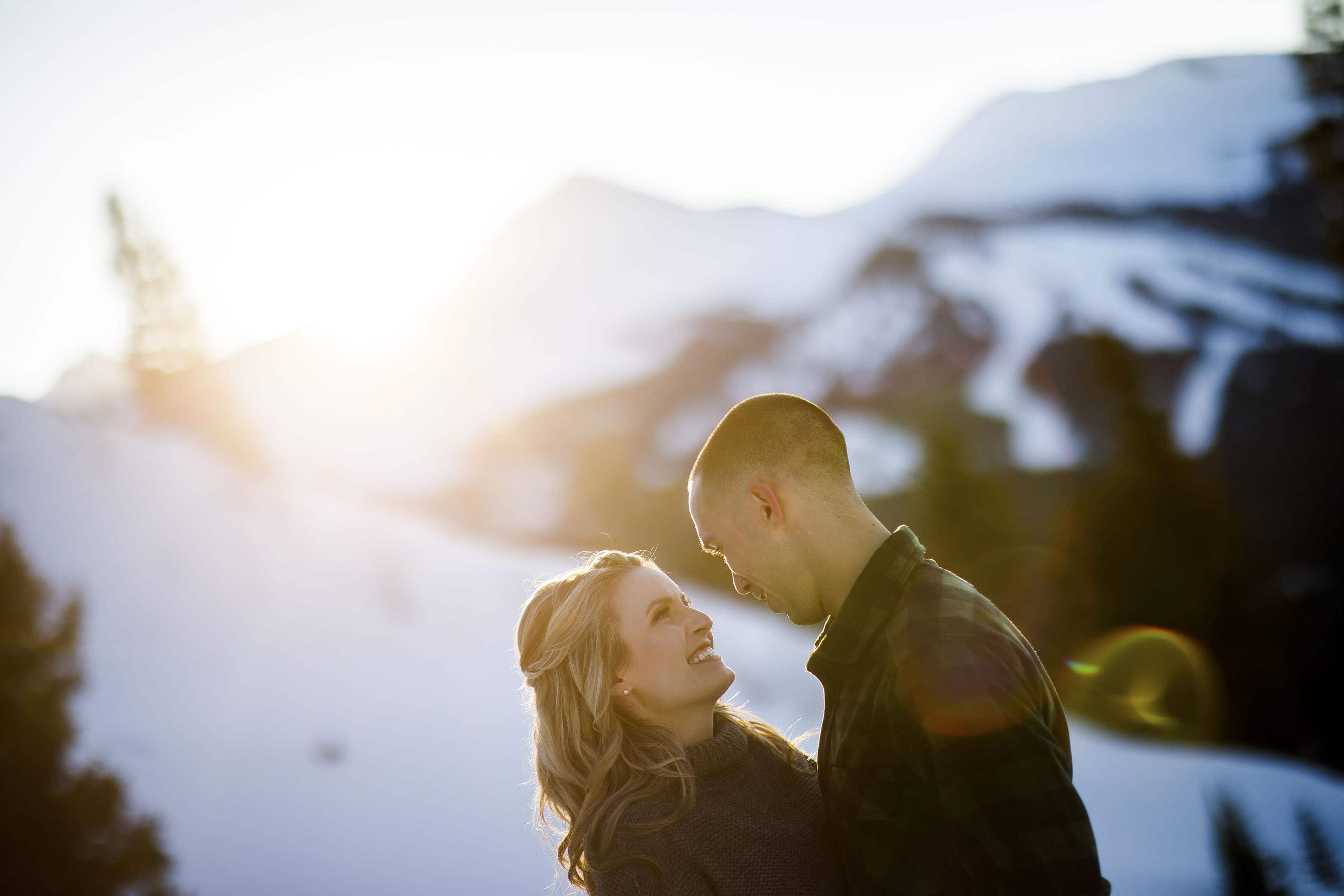 The sun sets over Peak 8 in Breckenridge during Cassidy and Shane's winter engagement photos