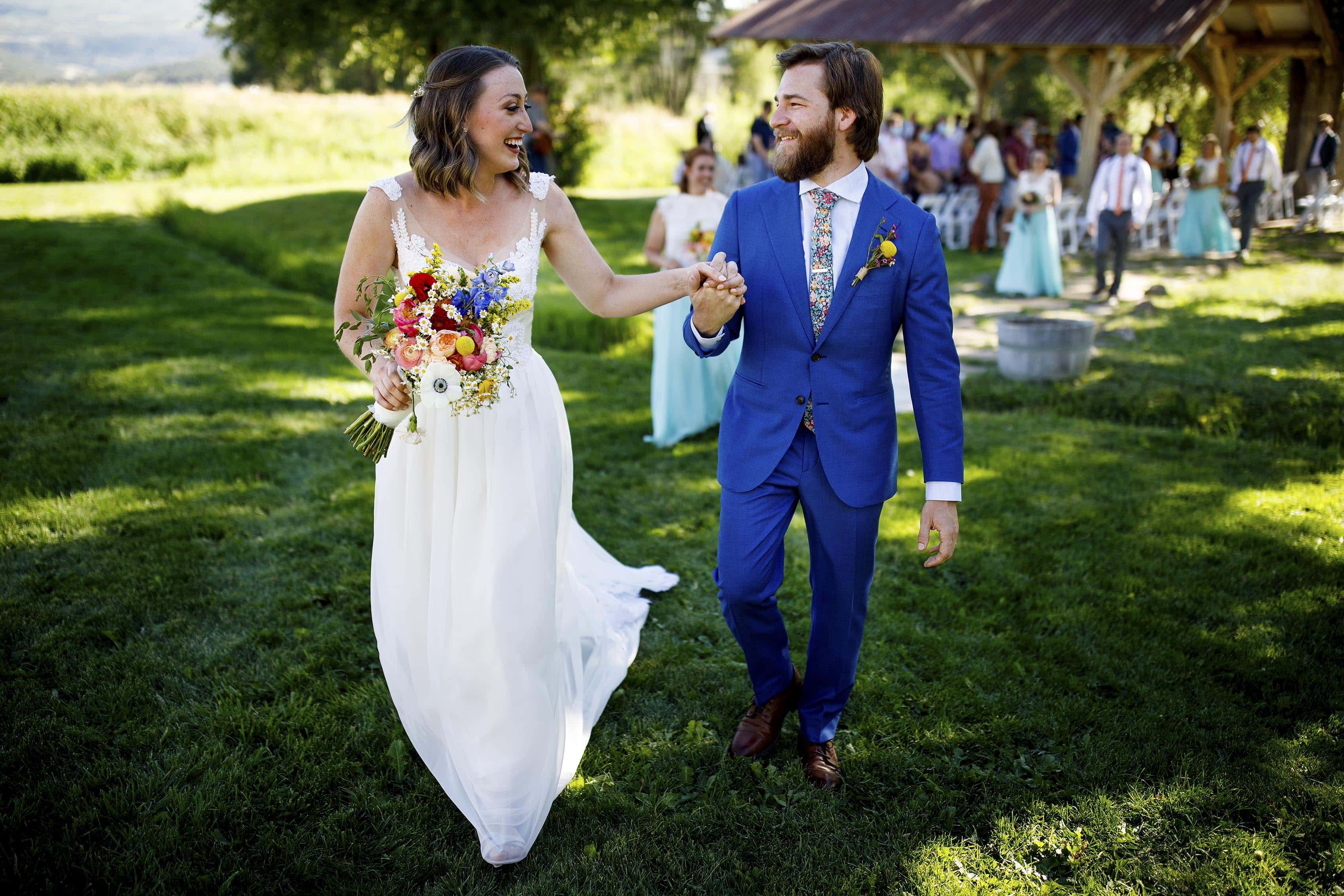 Laura and Ryan celebrate after their wedding ceremony at 4 Eagle Ranch in Wolcott, CO