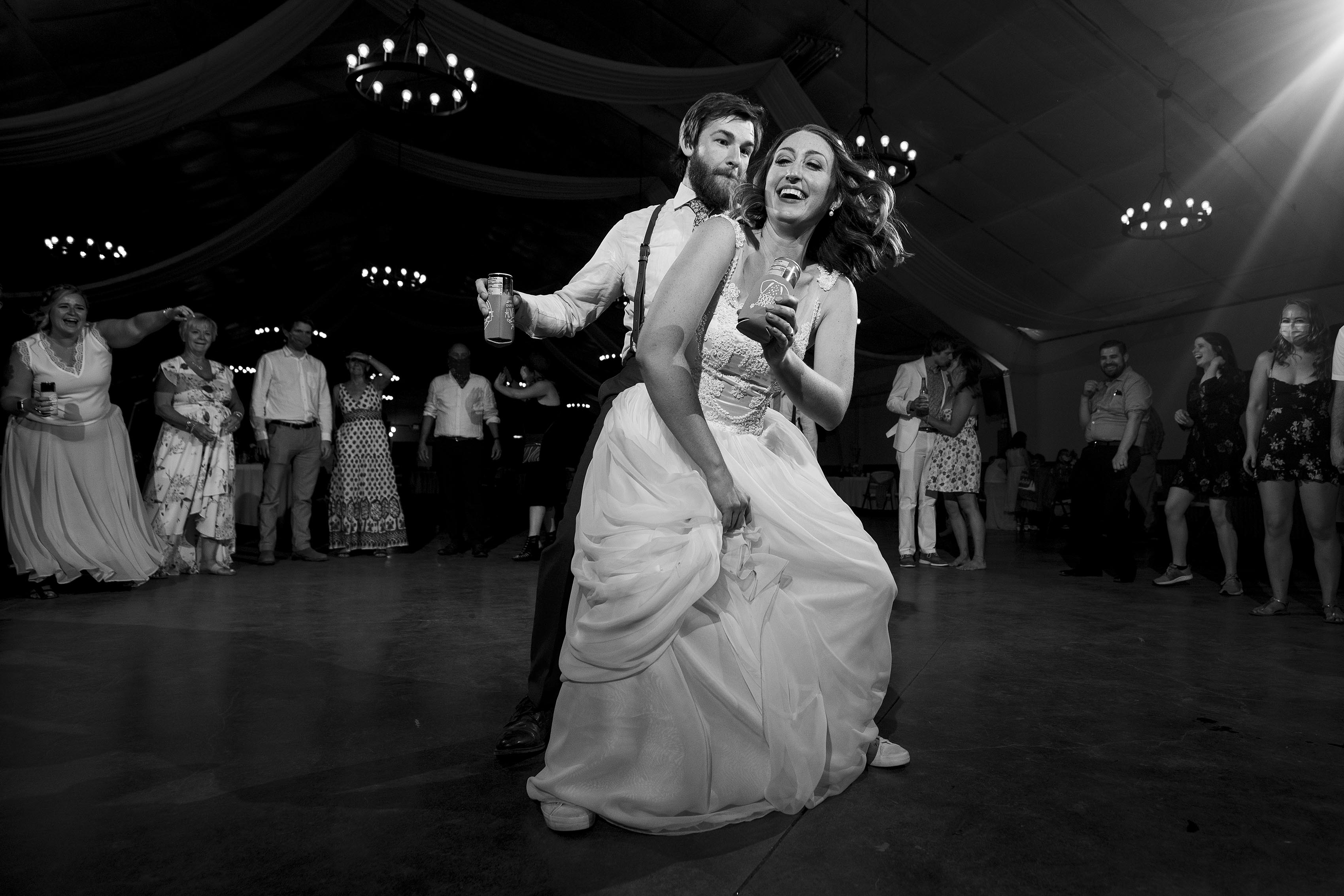 The bride and groom dance together at 4 Eagle Ranch during their wedding reception in Wolcott, CO