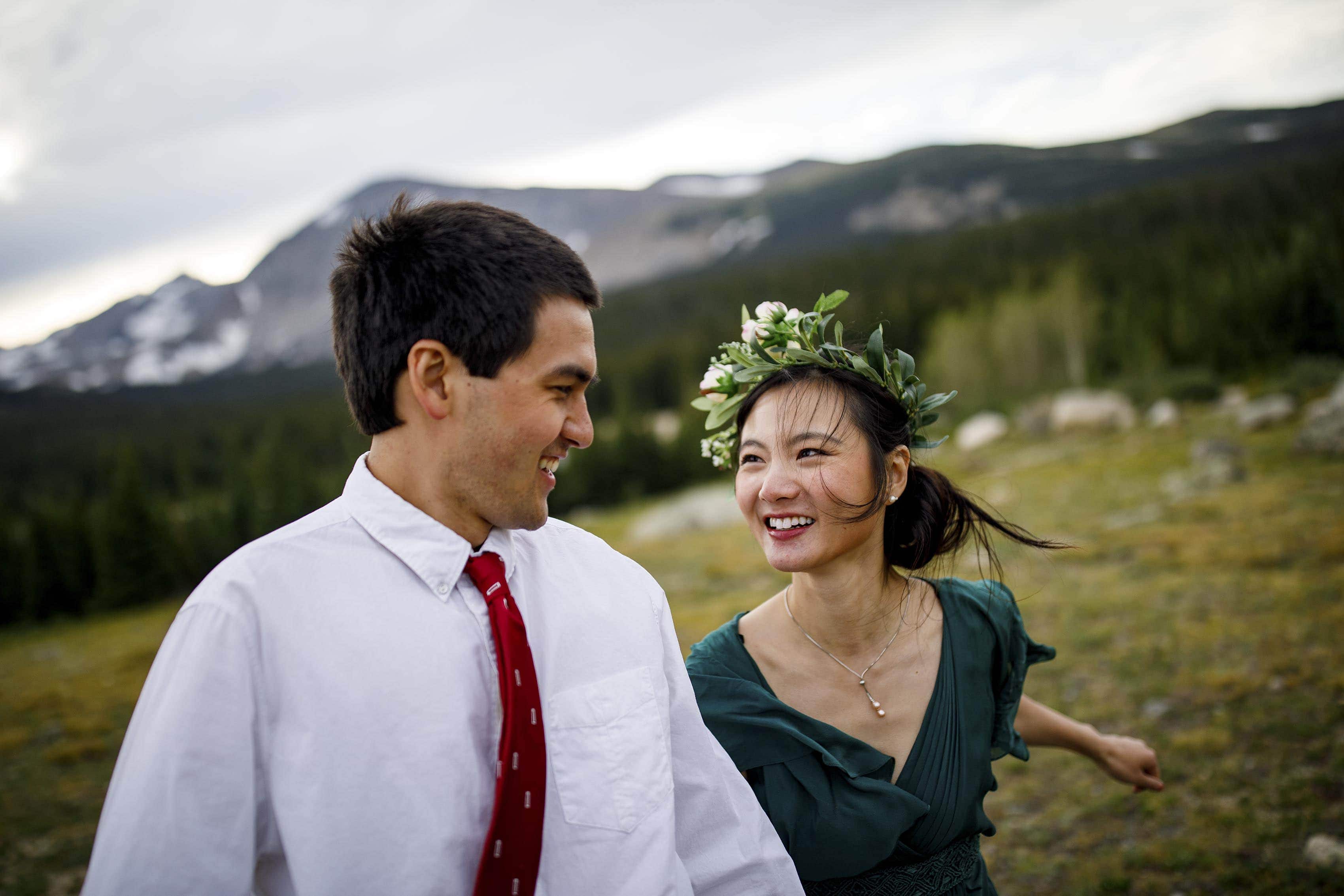 Cecelia and Jamie laugh together at Brainard Lake during their elopement
