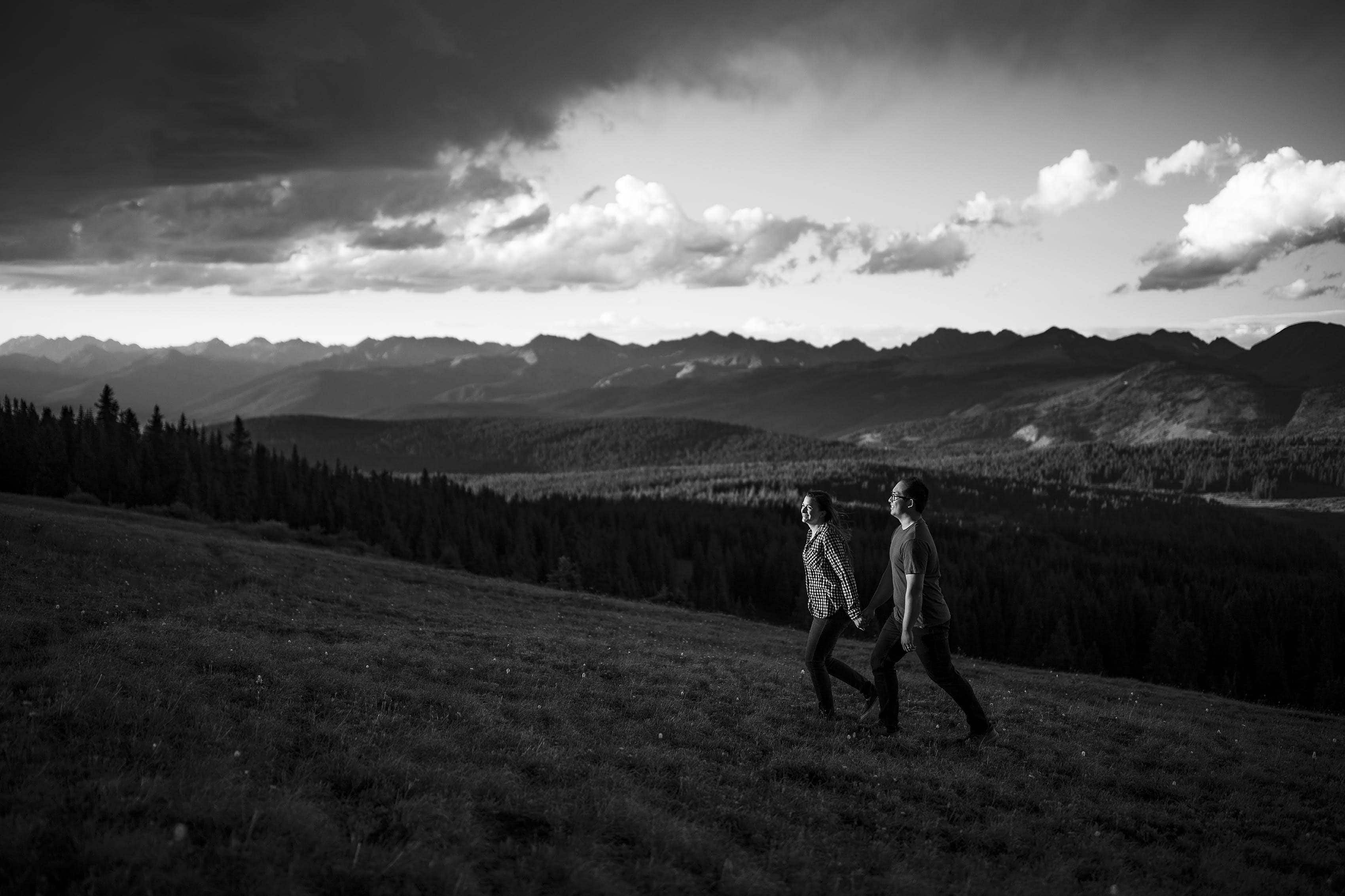 Courtney walks with Mike atop Shrine Pass during their engagement photos