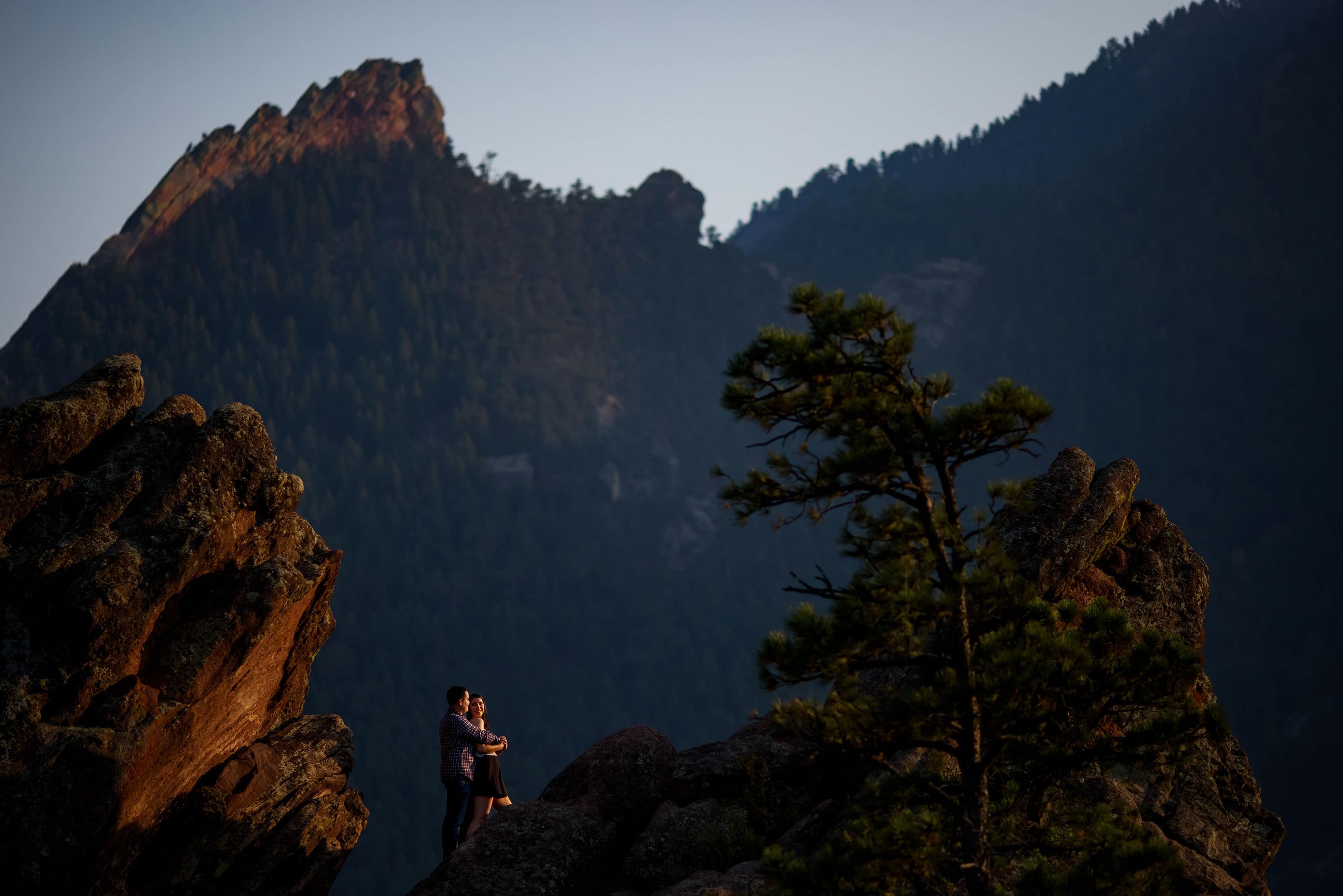 A couple poses together on Flagstaff Mountain during their Boulder engagement session